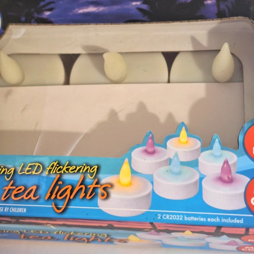 Banana Boat 6 Pack Floating LED Flickering Tea Light Candles Multicolor NIB